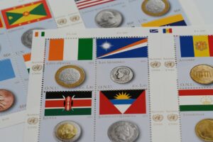 A collection of stamps featuring various countries and their flags, symbolizing global currency exchange.